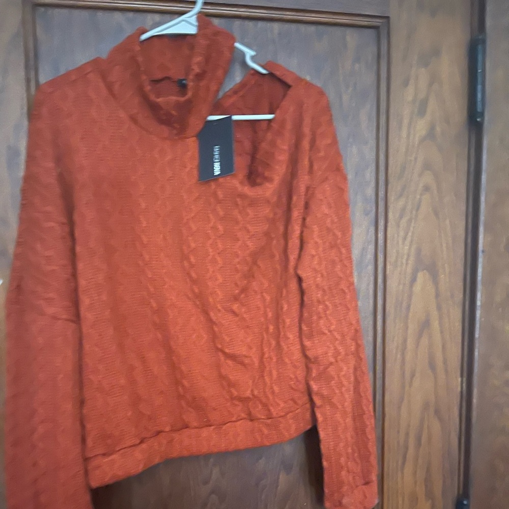 A cut out off the should NWT sweater